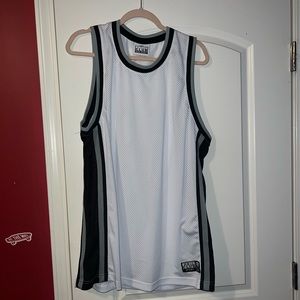 It is a large white and black pro club basketball jerseys